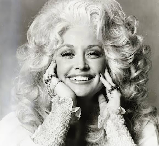 Black-and-white portrait of a smiling Dolly Parton by Irving Penn