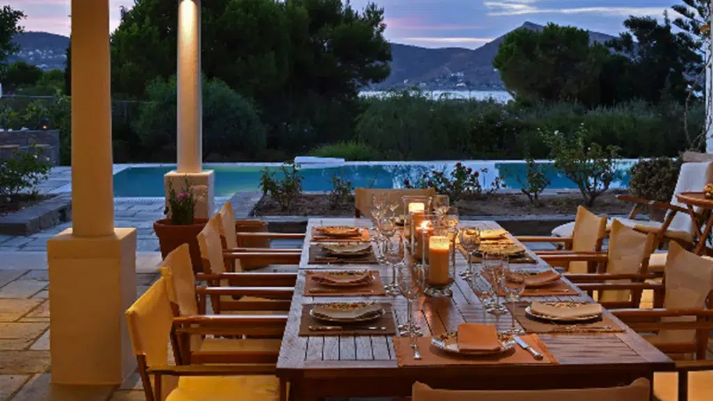 A table set for dinner with candles on it
